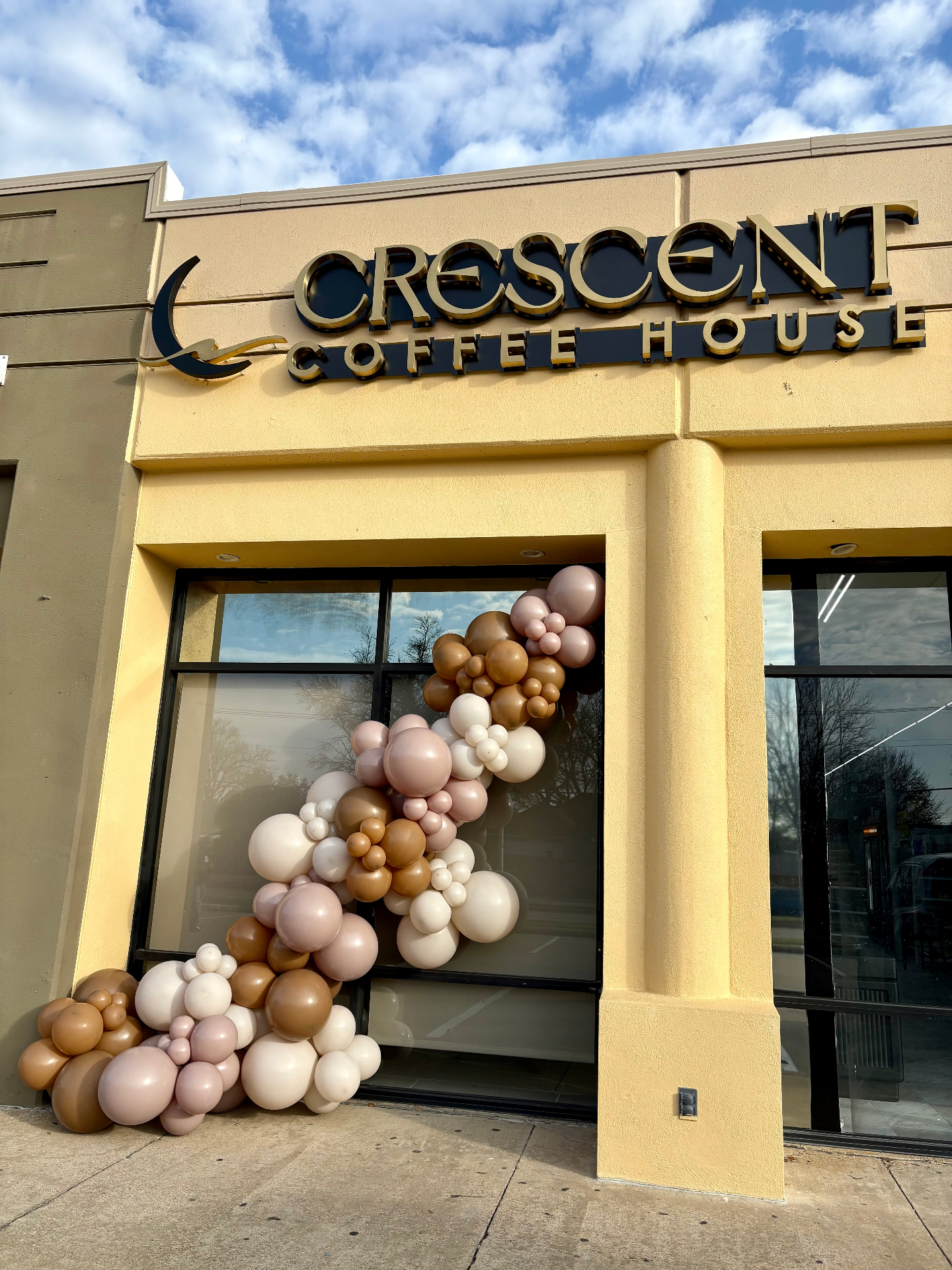 Crescent Coffee House storefront with balloon arch